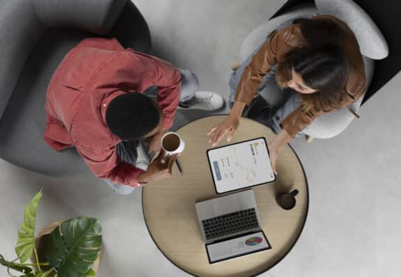 Two people working on optimising their digital experience