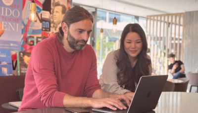 Man-and-woman-work-at-laptop-distant-shot